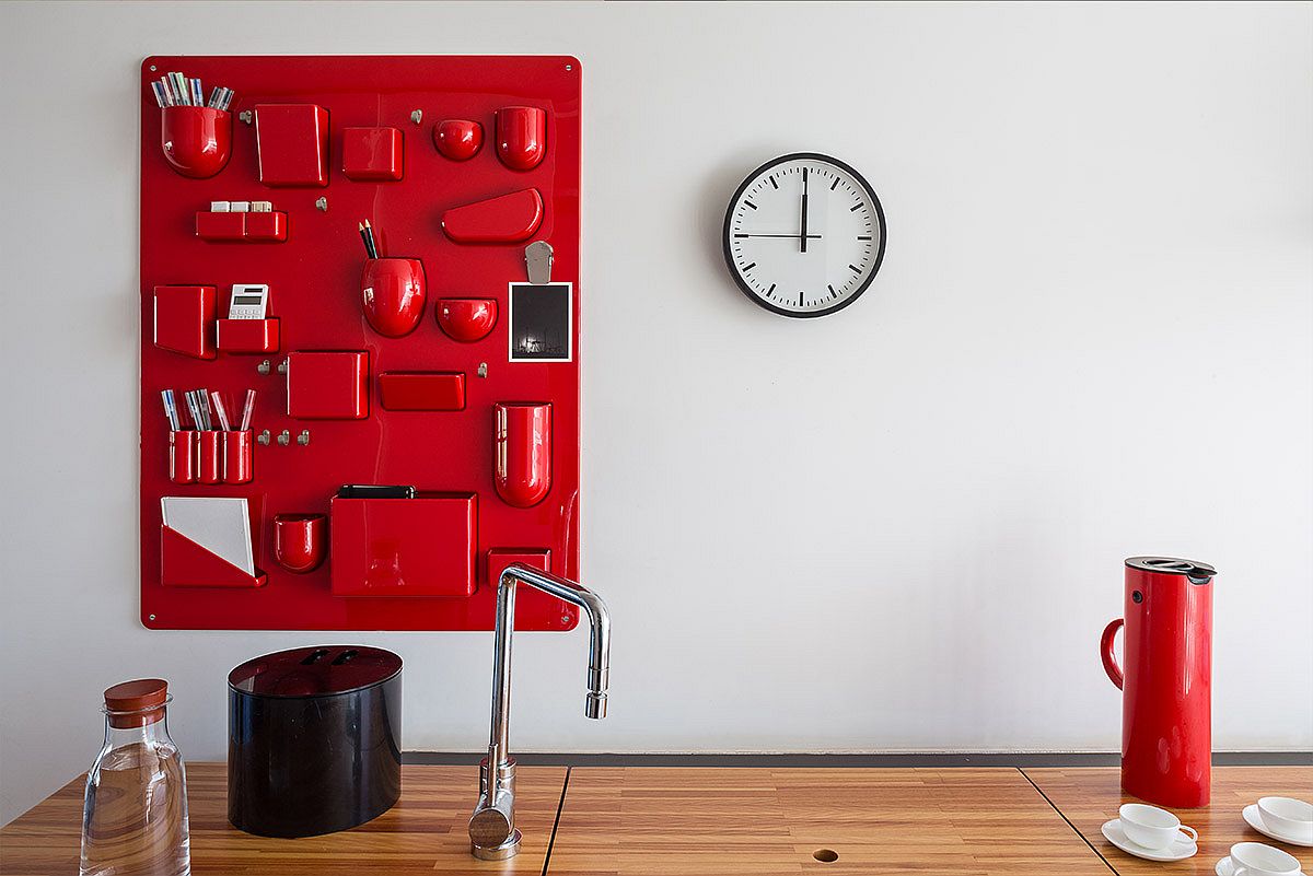 Custom wall-mounted storage solution in brilliant red for the modern kitchen