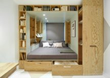 Custom-wooden-box-inside-the-bedroom-niche-with-ample-storage-and-shelving-units-also-houses-the-bed-16181-217x155