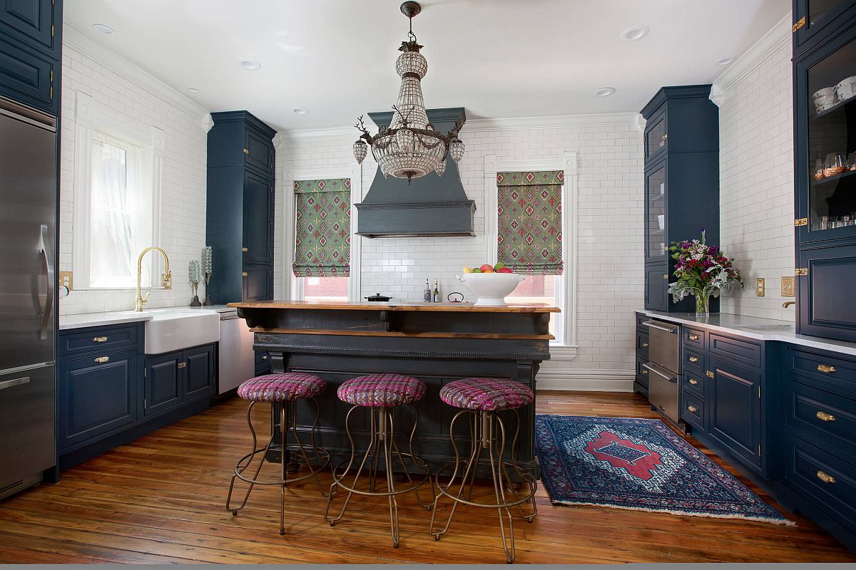 Dark blue cabinets for the Victorian style kitchen that imbibes modern touches within it
