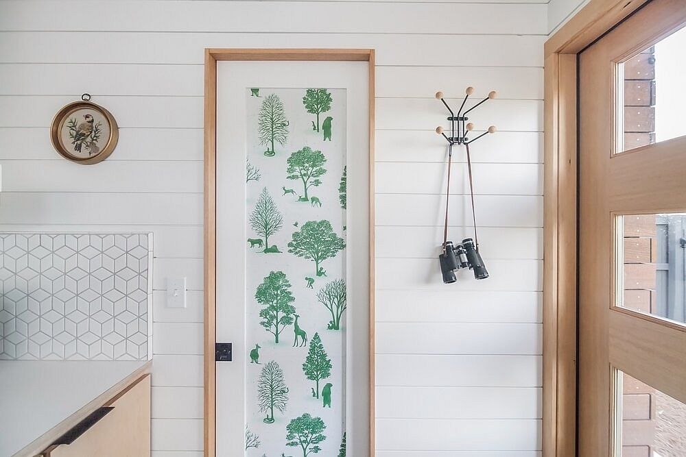 Decorating the interior of the tiny house with chic botanical prints that add color without overpowering the space