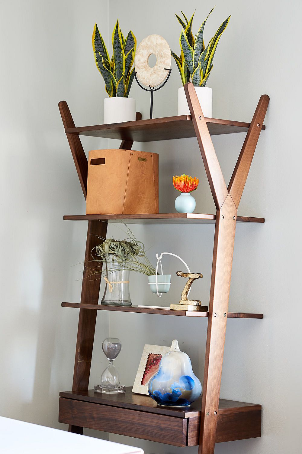 Desk and wooden shelf rolled into one and placed in the dining room corner save ample space