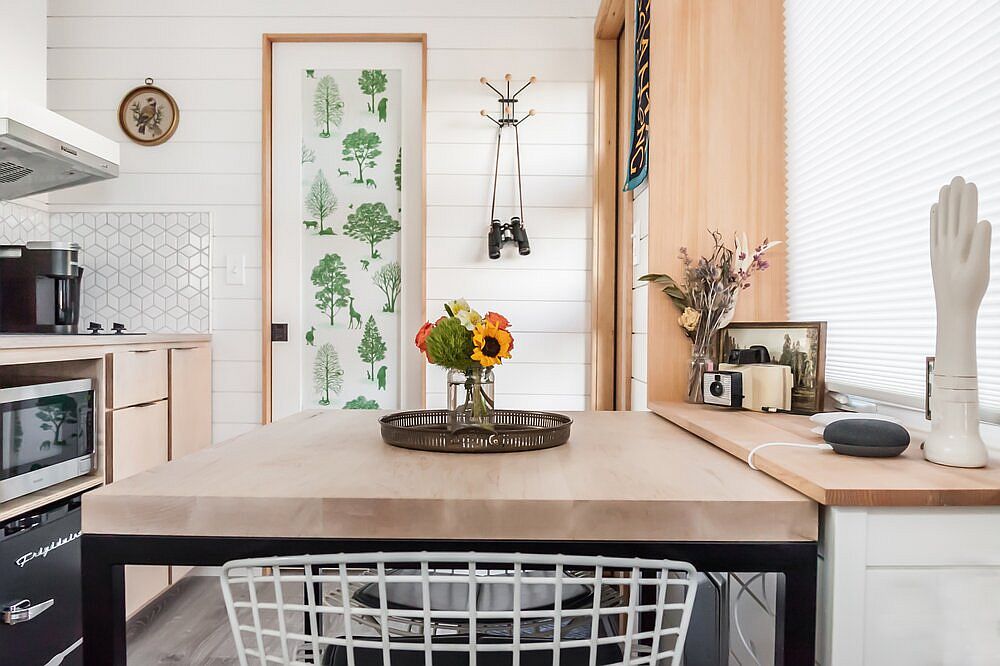 Dining area and small kitchen inside the backyard tiny house