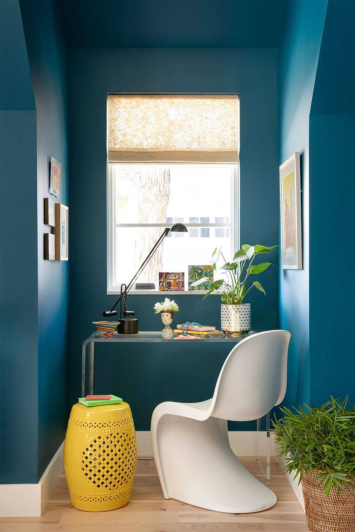 Exquisite blue home office with modern eclectic style and just a dash of yellow