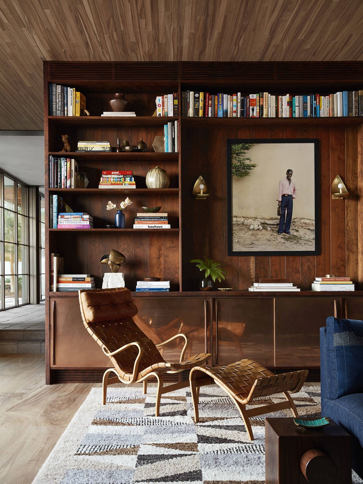 Fabulous walnut shelves and cabinets used throughout the house give it a cozy, modern look