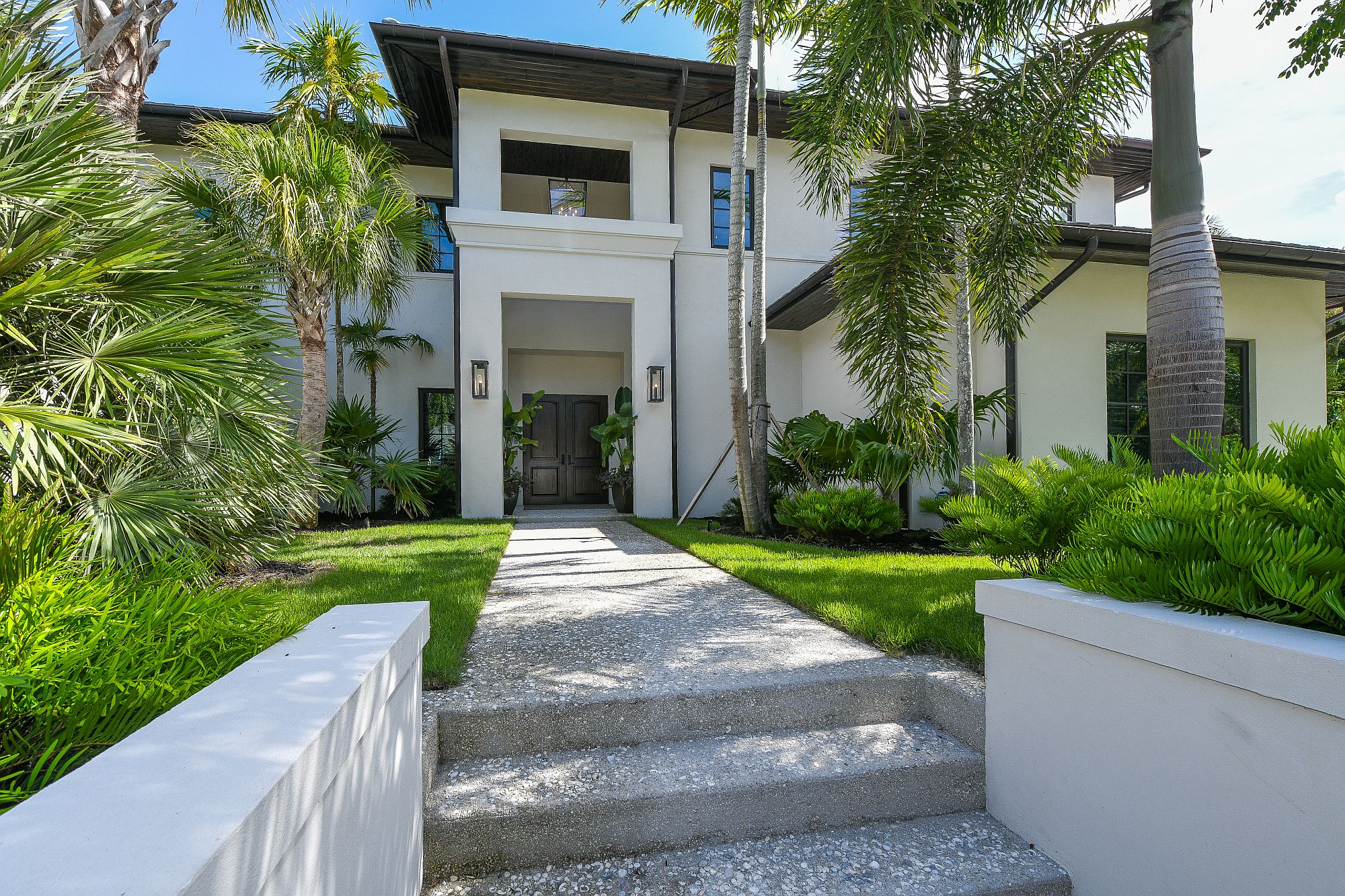 French West Indies style is combined with tropical goodness of Florida to create a luxurious modern home