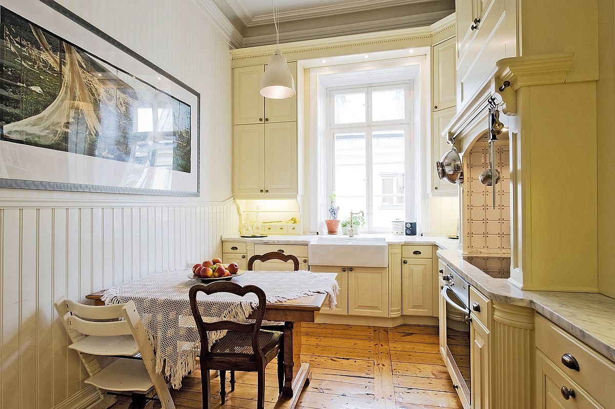 Gorgeous eat-in kitchen in Stockholm with marble countertops and cozy ambiance
