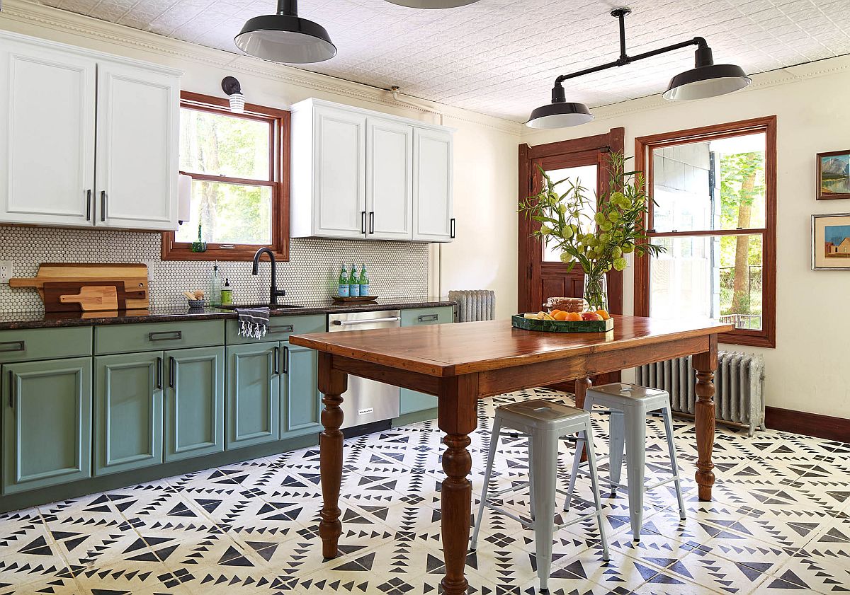 Green cabinets with matte finish, classic island and tiles with pattern for the spaciou Victorian style kitchen