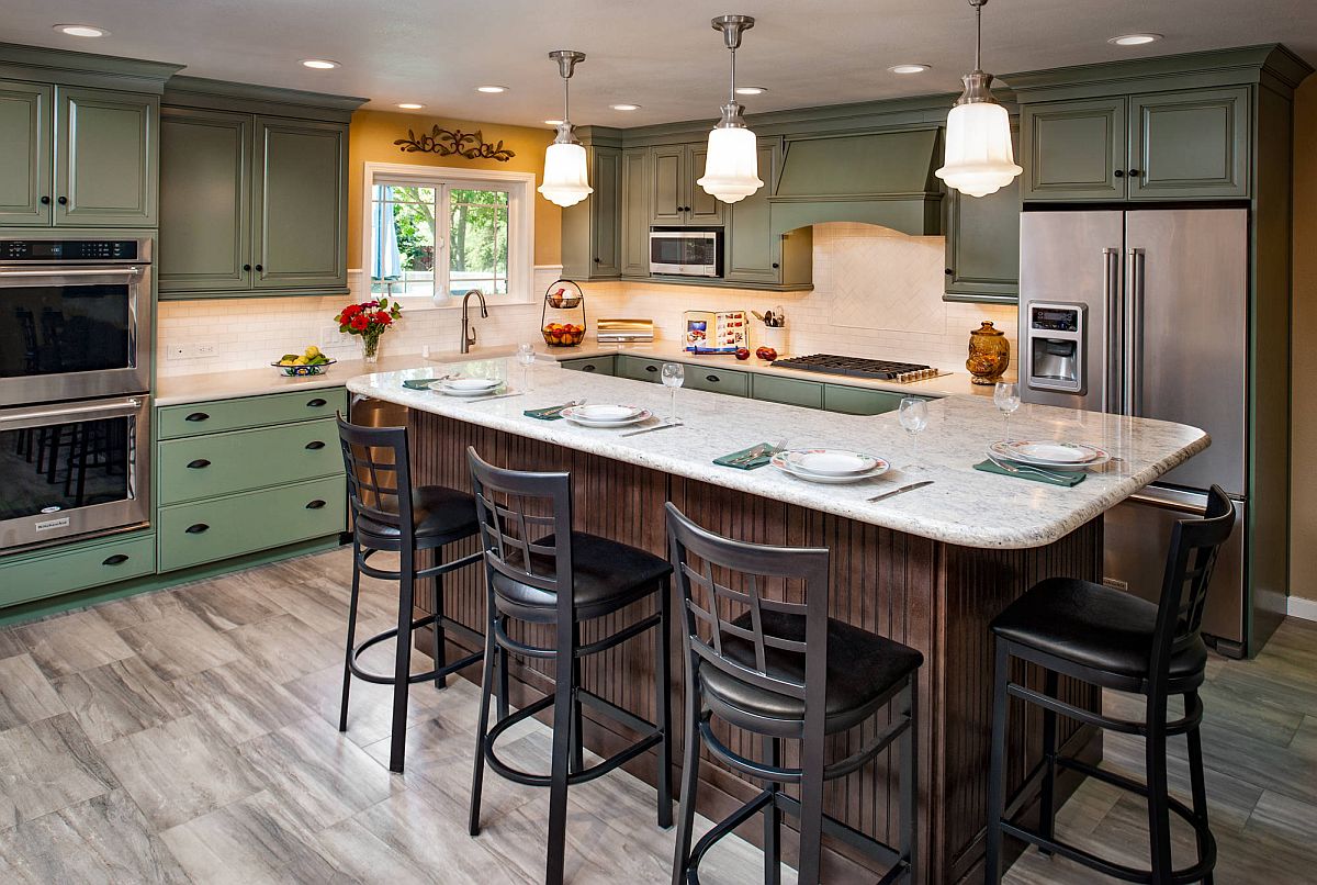 Just-a-dash-of-yellow-around-the-kitchen-window-enlivens-this-space-with-clasic-green-cabinets-53797