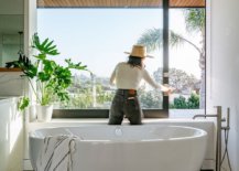 Large-freeestanding-bathtub-in-white-is-the-focal-point-of-the-spacious-modern-bathroom-86110-217x155