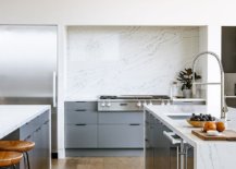 Light-bluish-gray-cabinets-in-the-kitchen-offer-contrast-to-the-wood-and-white-interior-84056-217x155