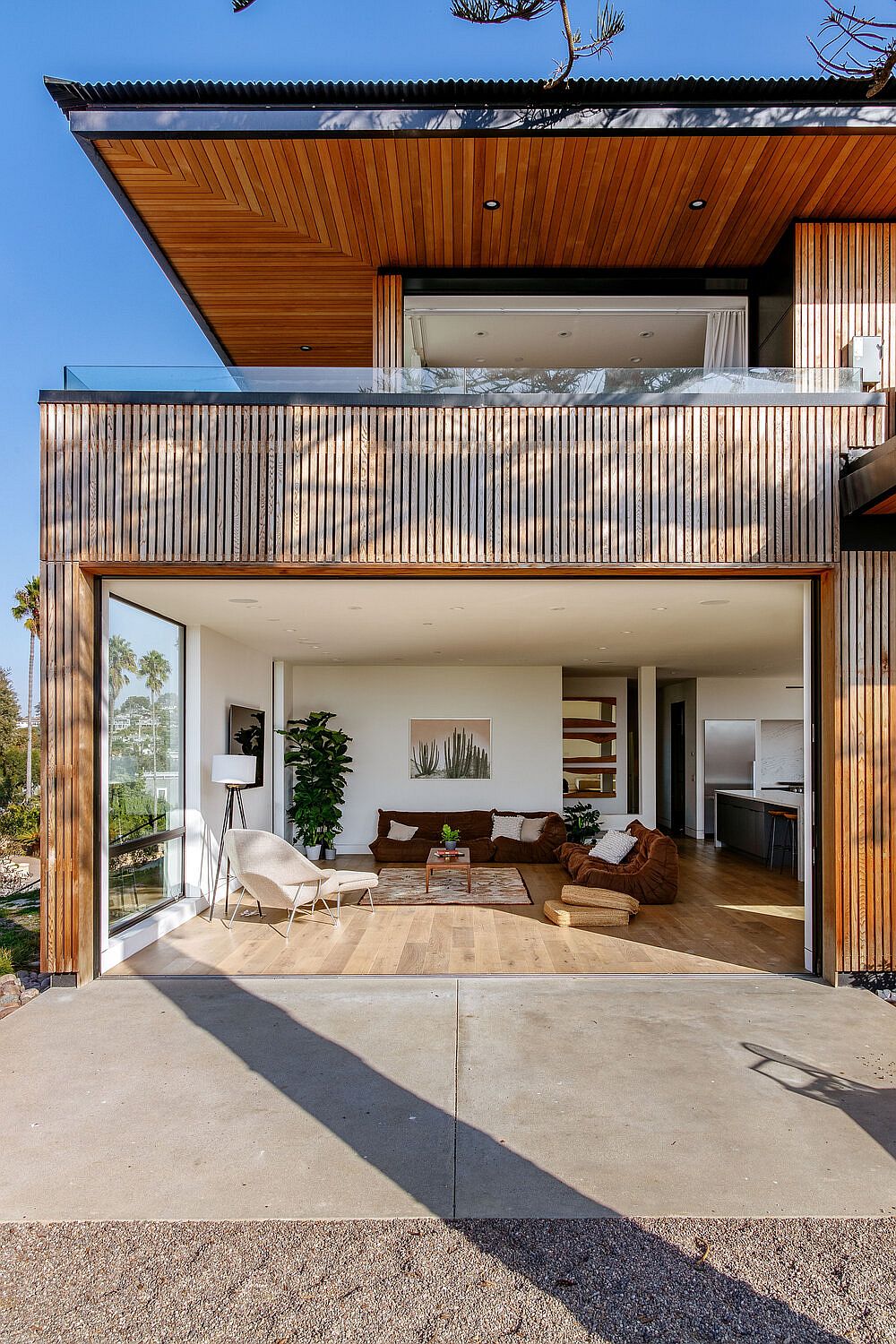 Living area can completely open up to the views outside using a series of glass doors