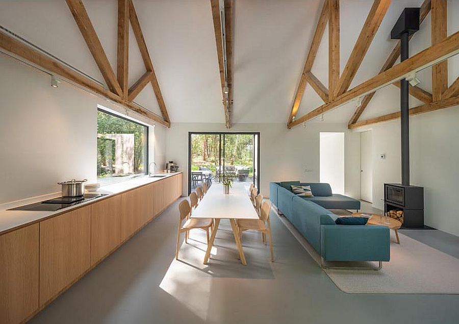 Living room, kitchen and dining area of the cabin with connectivity to the outdoors