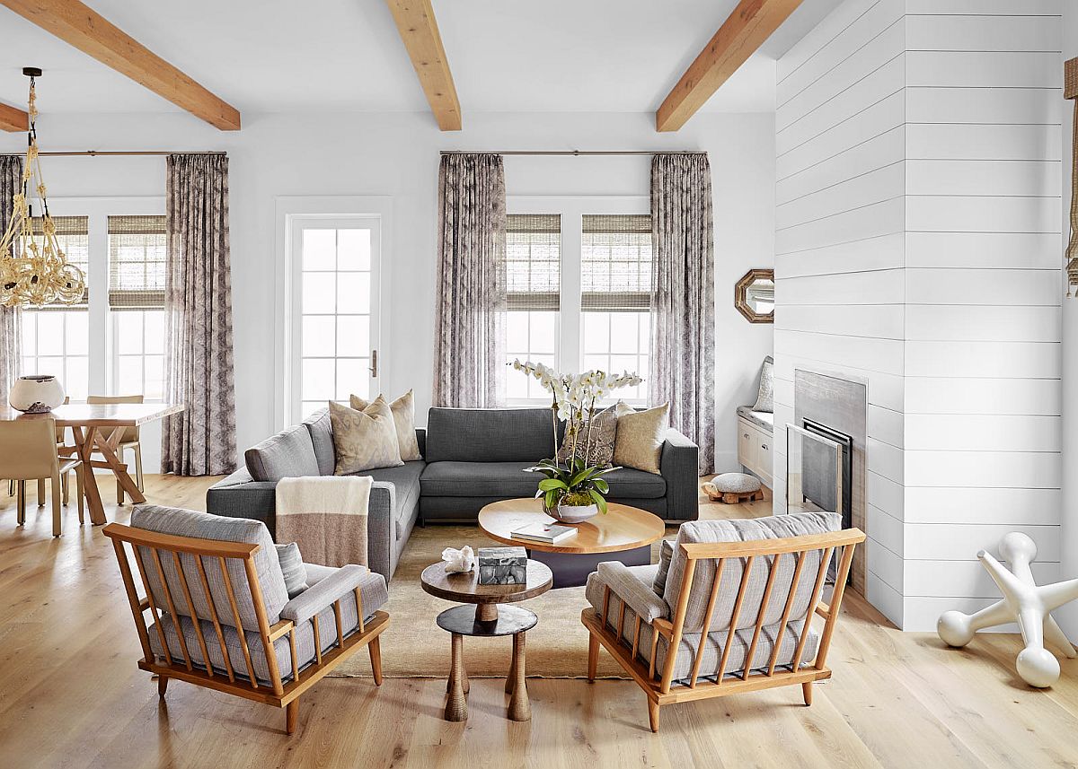 Living room walls with textural charm, ceiling beams that add woodsy element and cool decor