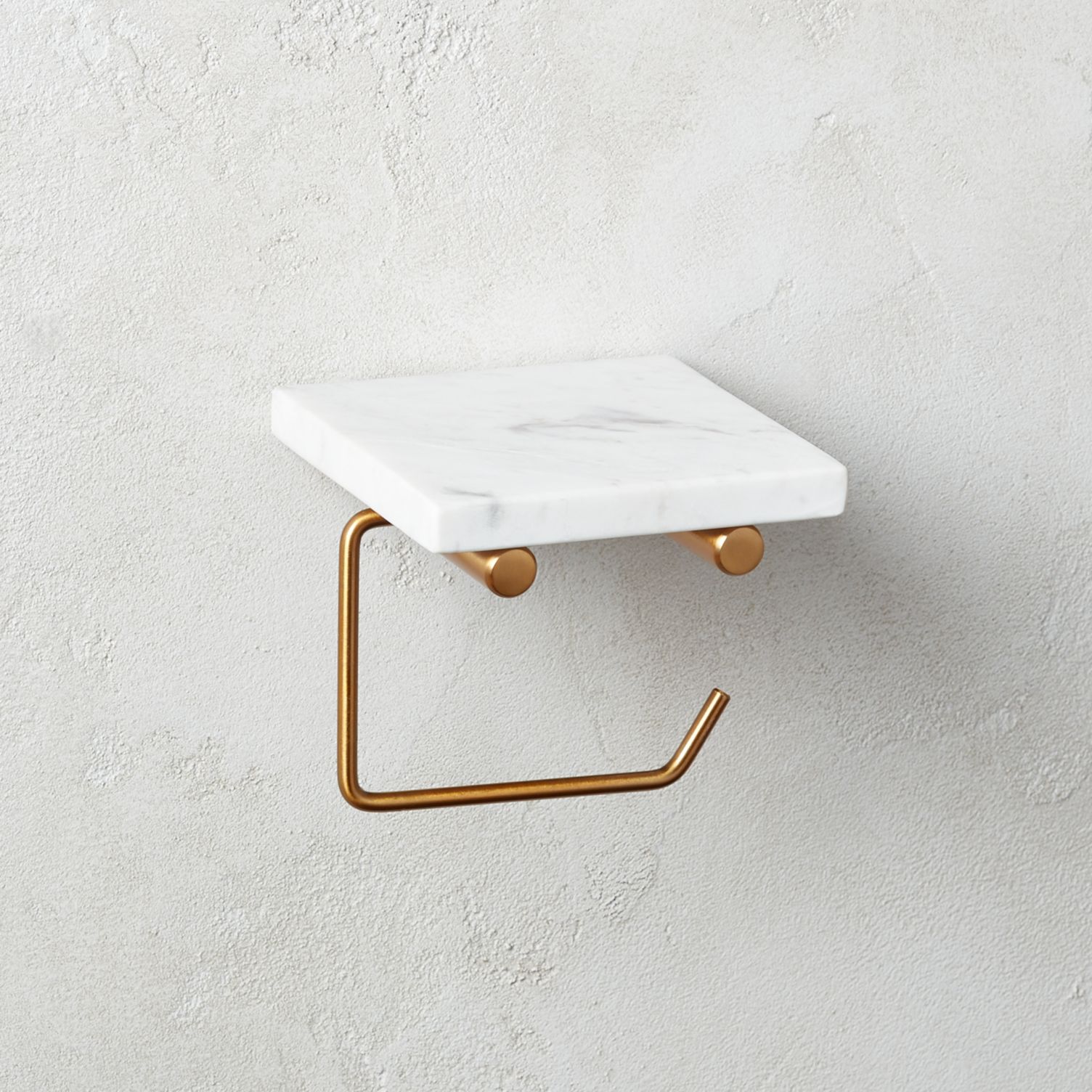 https://cdn.decoist.com/wp-content/uploads/2020/07/Marble-and-brass-toilet-paper-holder-69647.jpeg