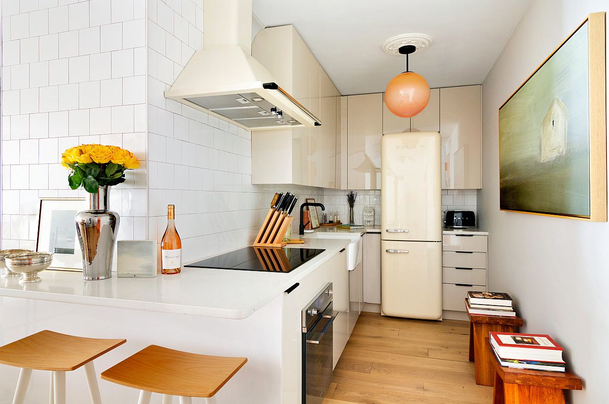 Midtown apartment kitchen in New York that maximizes space with ample shelving and a backdrop in white