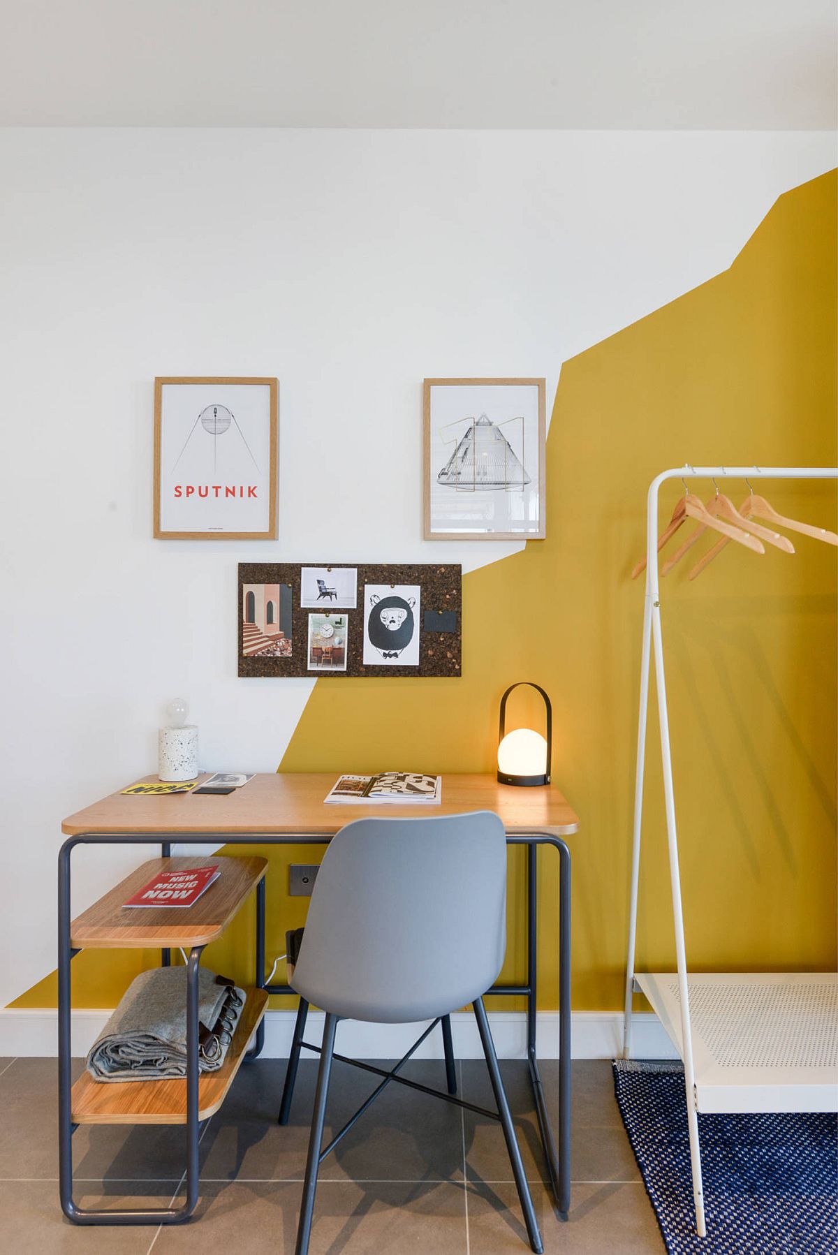 Modern eclectic home office with a white and yellow backdrop that steals the show