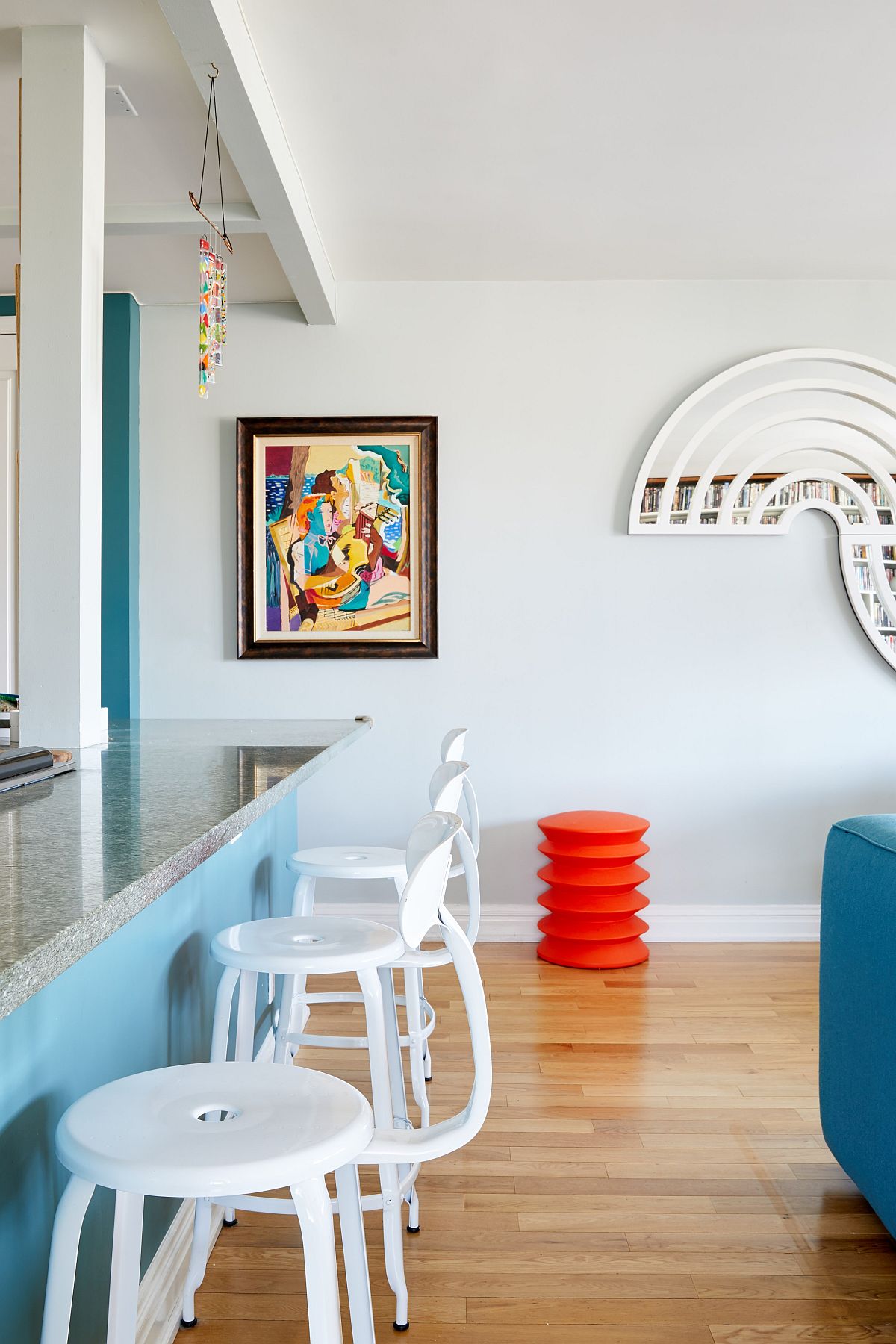 Modern minimal kitchen of NYC home coupled with lovely pops of color