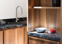 Natural-black-granite-worktops-in-the-kitchen-coupled-with-wooden-cabinets-create-a-fabulous-atmosphere-90177-217x155