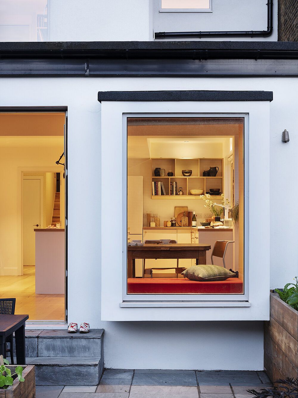 New kitchen on the lower floor with large window that connects it to the outdoors