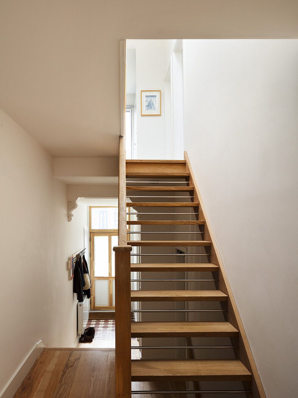 Open-tread timber staircase replaces the old stairway in the home