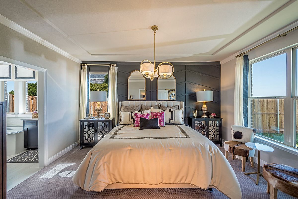 Ornate gray wall with pattern matches the glam of the bedroom!