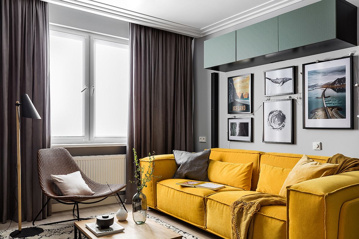 Plush and dashing couch in yellow for the modern Scandinavian living room in gray with small gallery wall