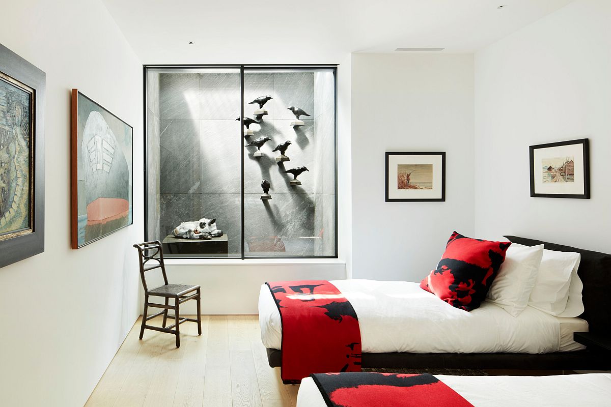 Polished teen bedroom in white with dazzling splashes of red brought in by bed sheets