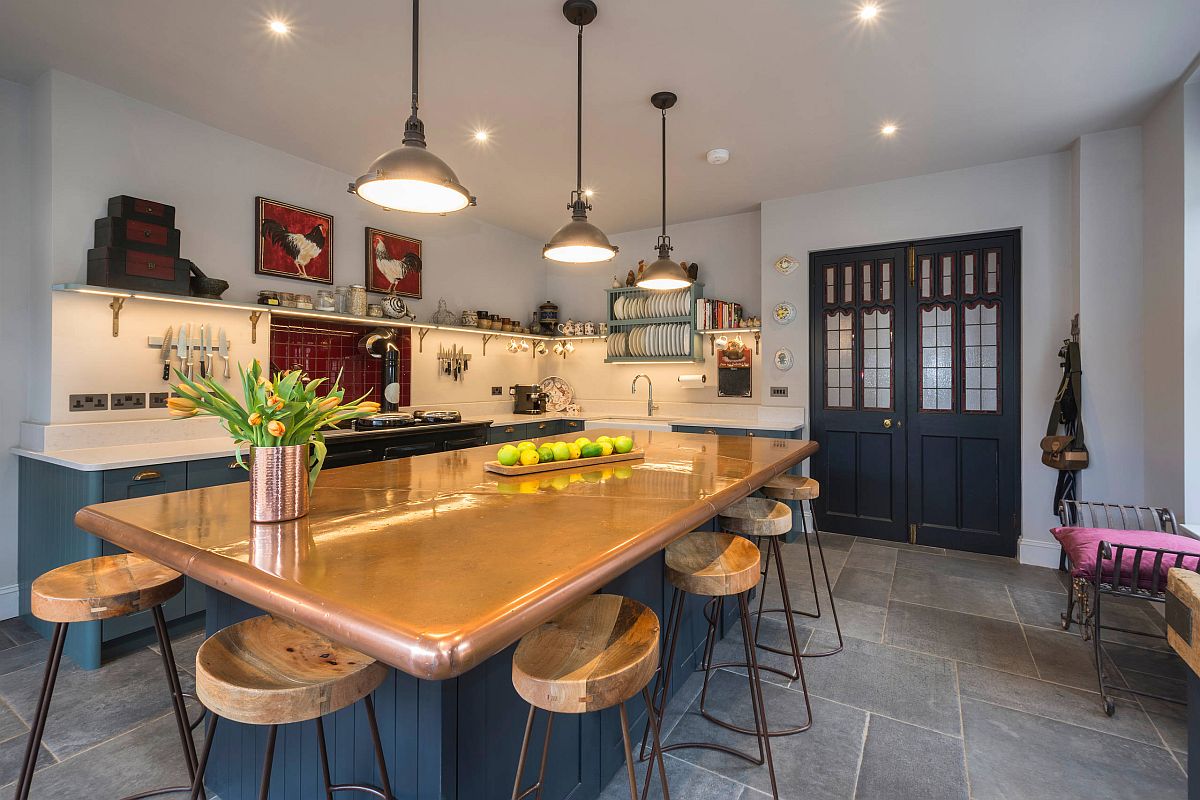 Sprakling custom copper kitchen countertop steals the show in here with bluish-gray shaker style cabinets in the backdrop