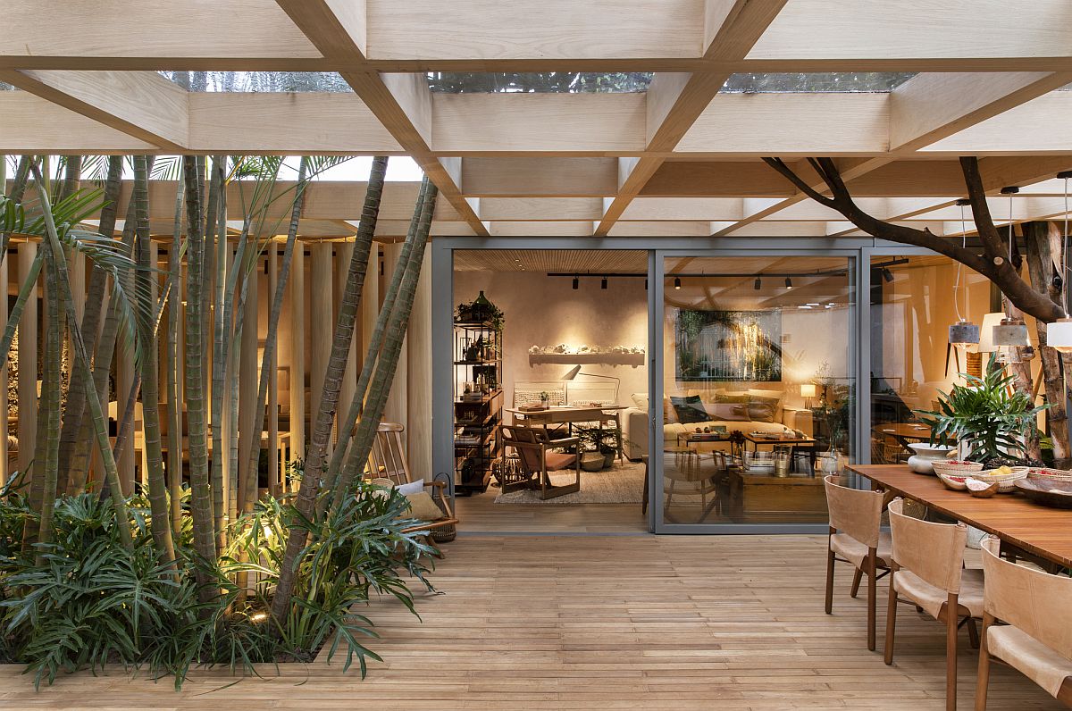 Stunning shroud of wood and green drapes this fabulous forest house in Brazil