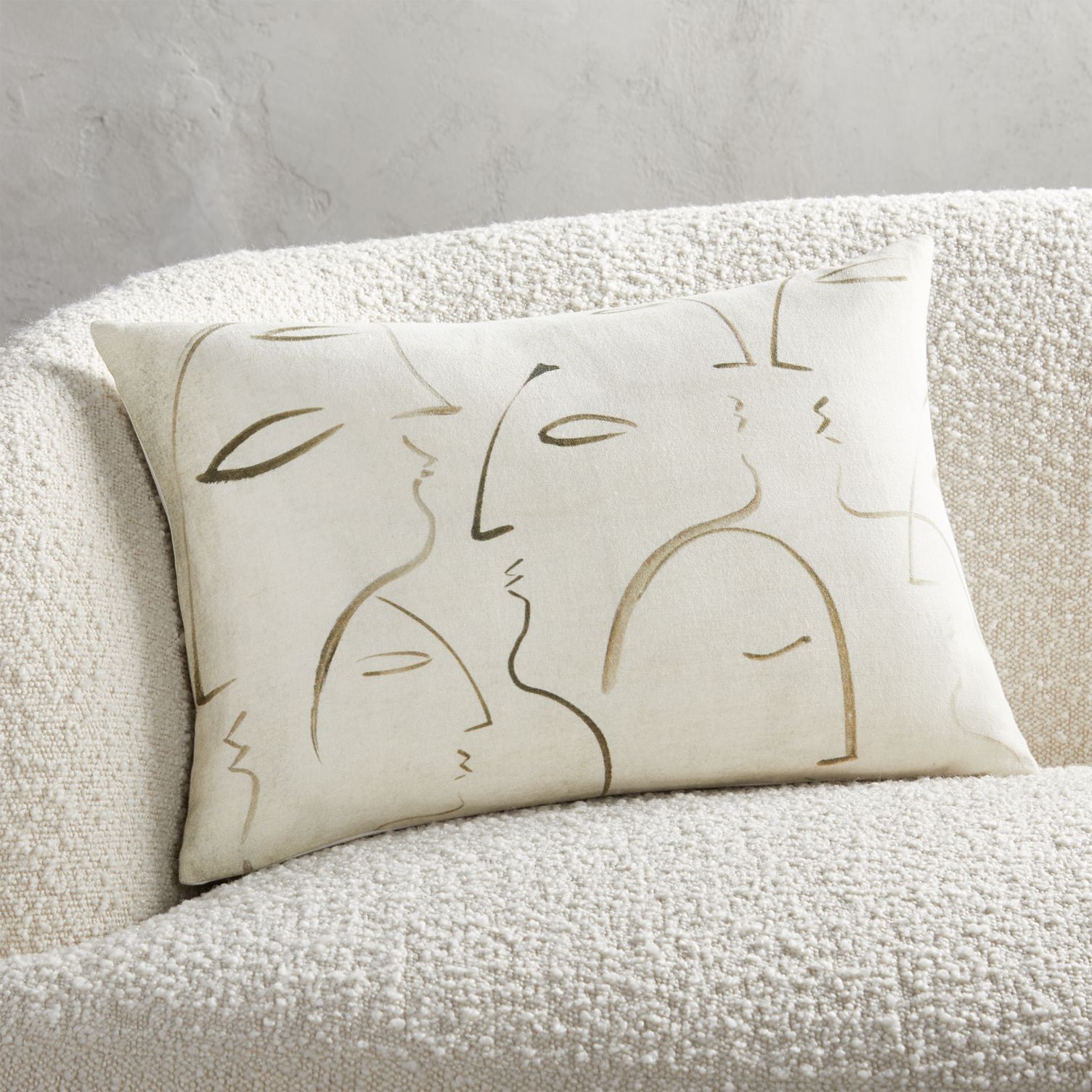 Throw pillow with line drawing faces