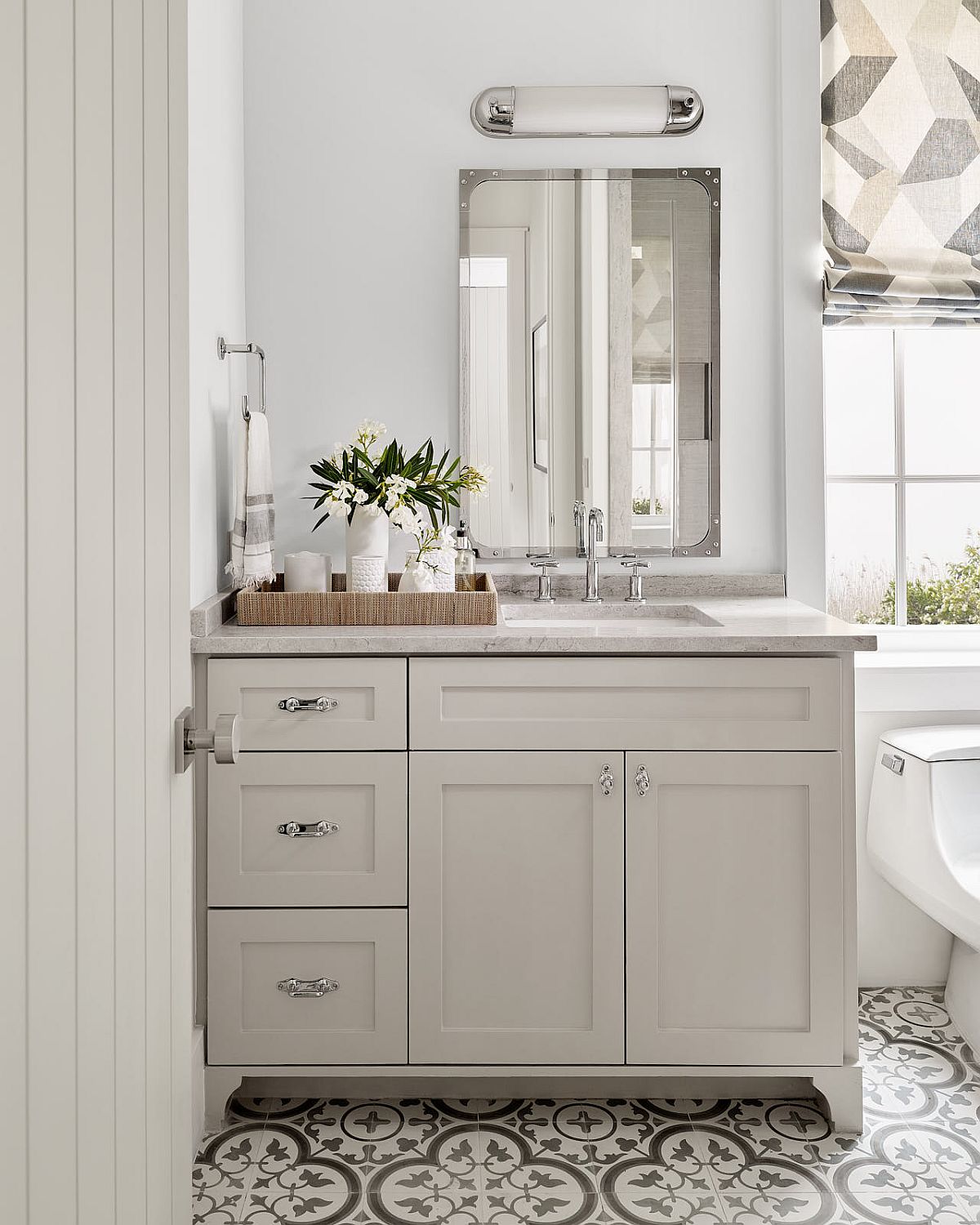 Tiles add pattern to the beach style bathroom without altering its color scheme