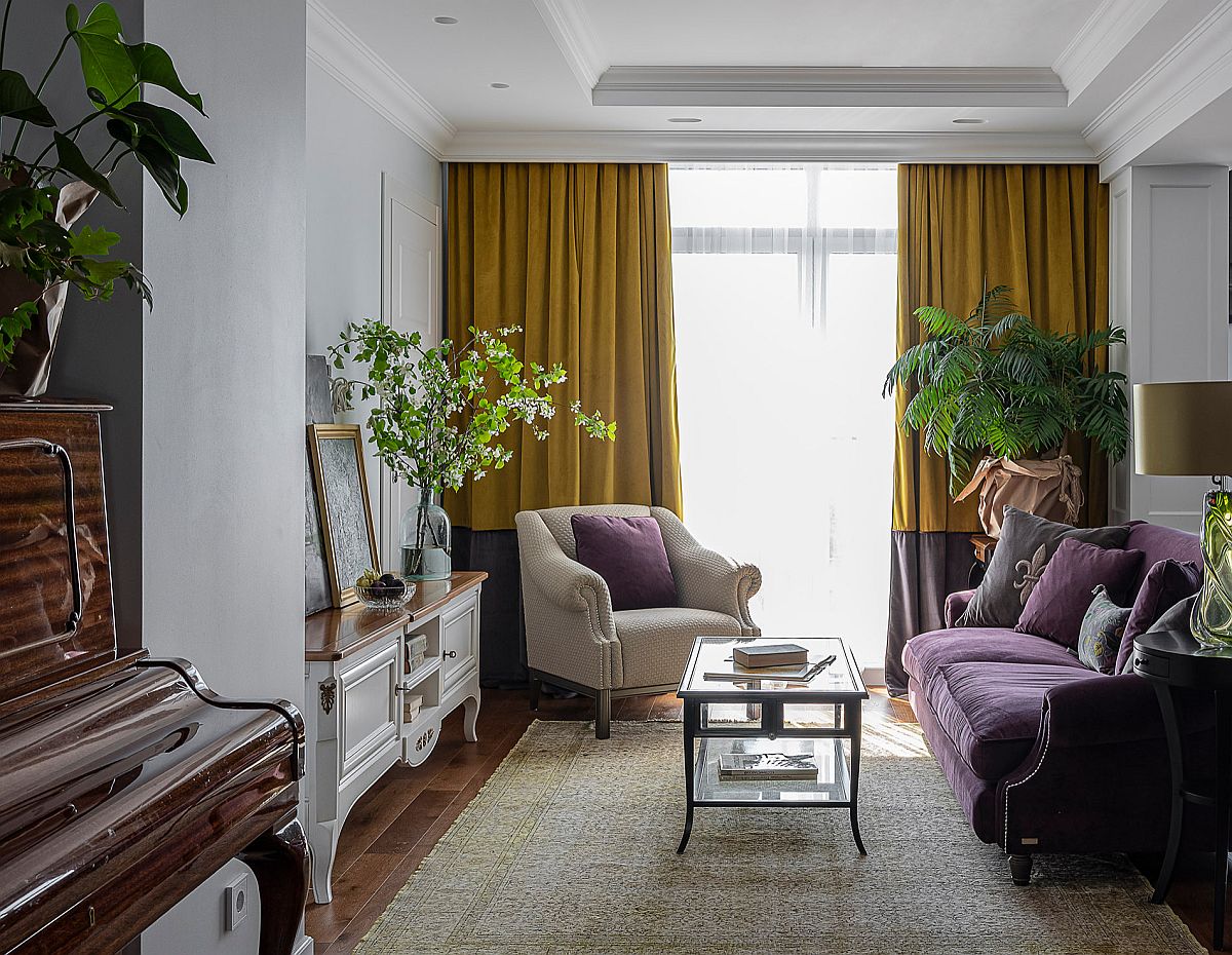 Traditional living room with limited space, bold purple couch and drapes in yellow