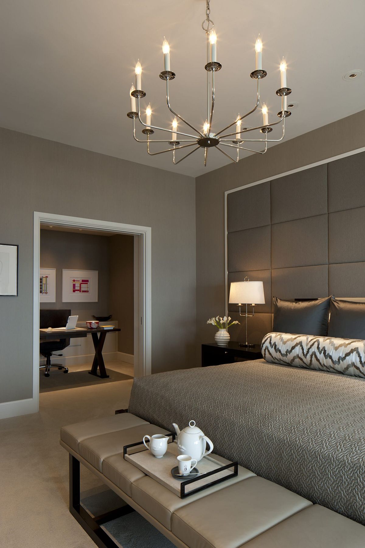 Tufted wall-covering in gray perfectly captures tone-on-tone approach to decorating with gray in this bedroom