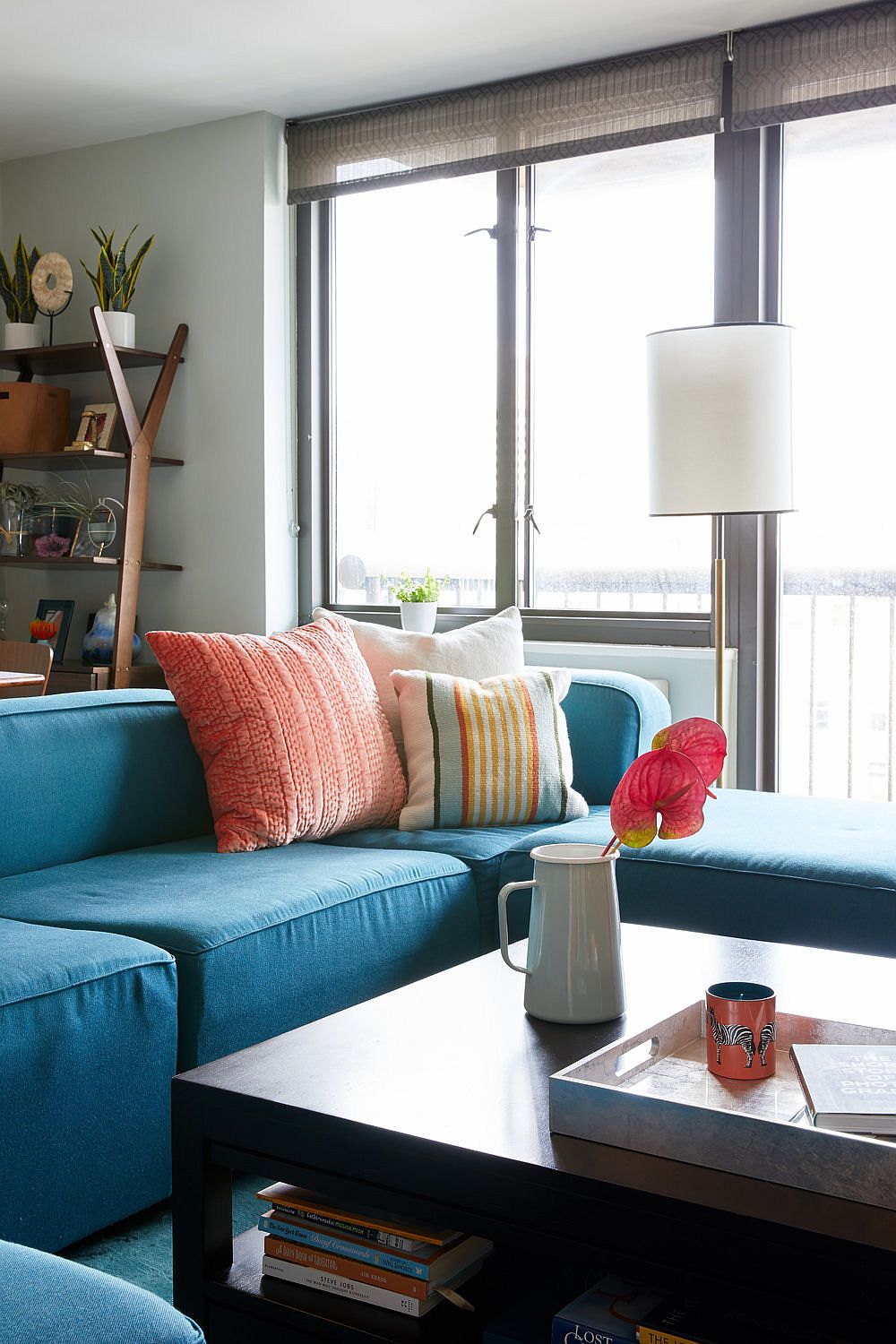 Use smart accent pillows along with a brightly colored couch for a more colorful contemporary living space