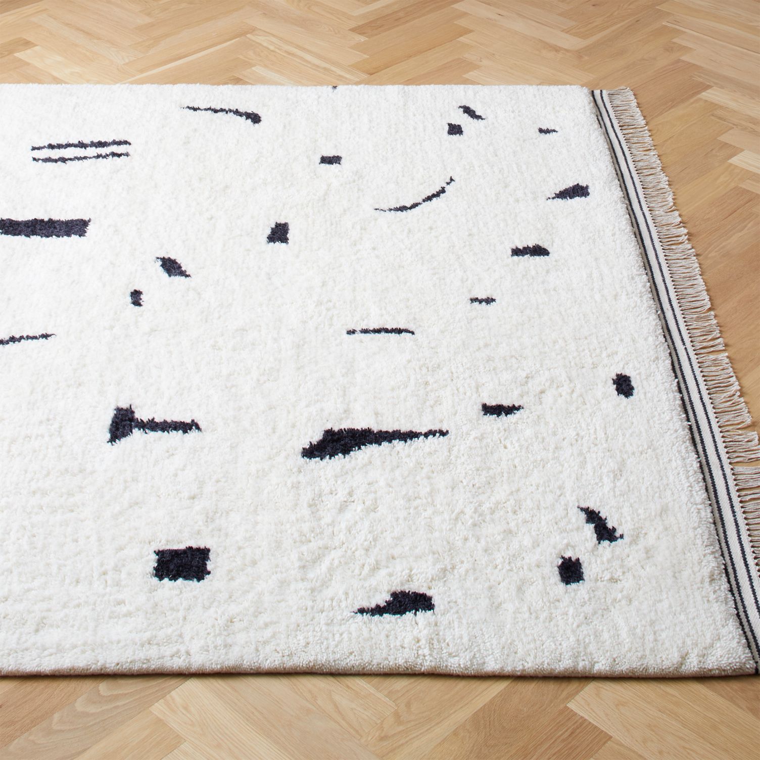 White rug with black abstract design