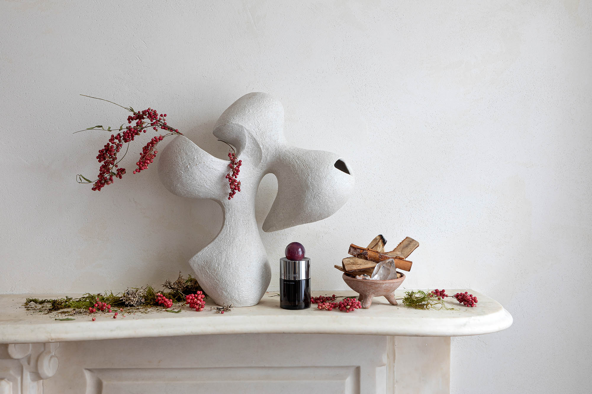 White sculpture on a fireplace mantel