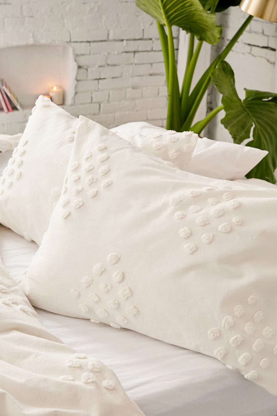 White tufted geometric shams