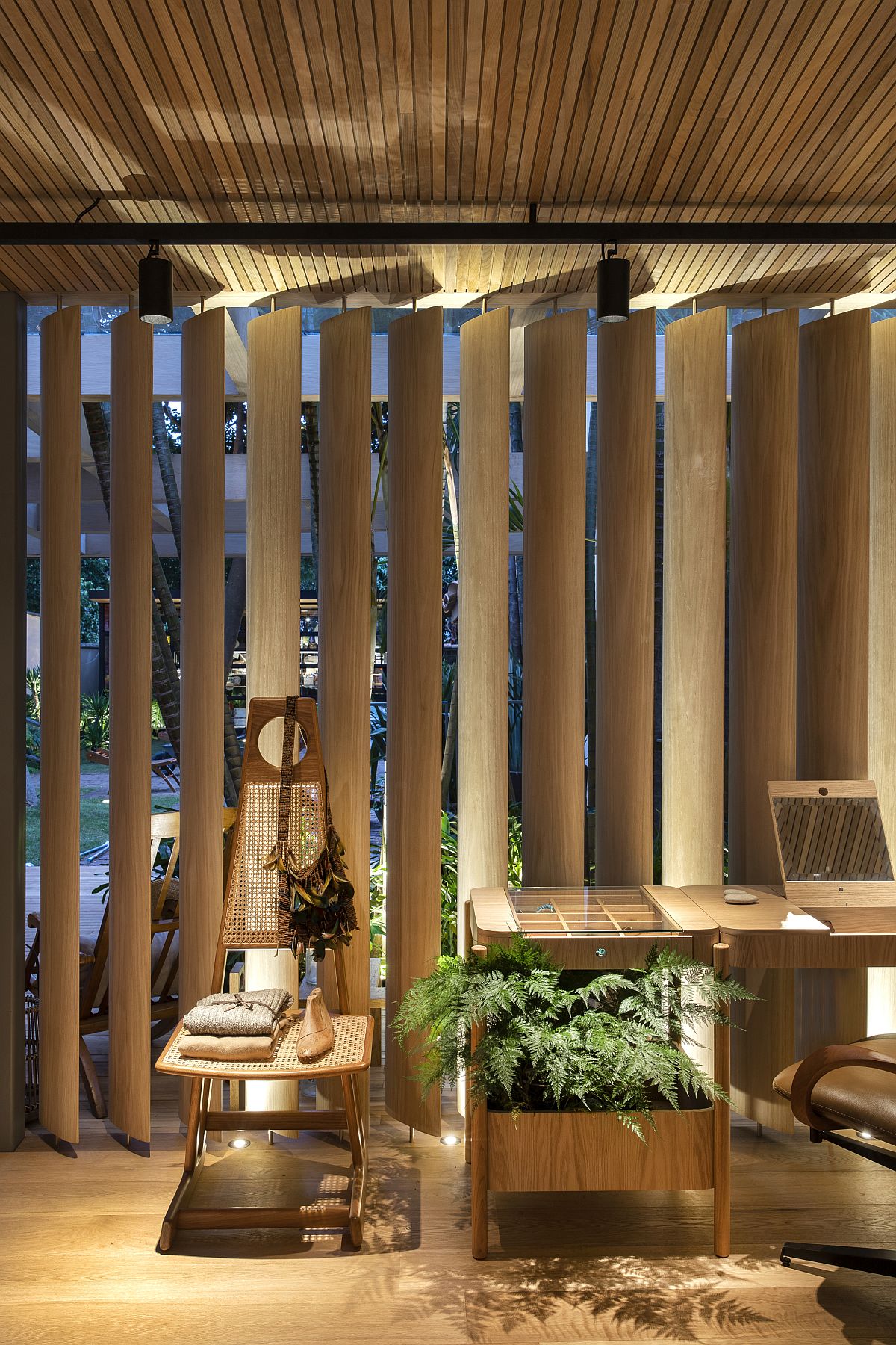 Wooden brise soleils and frames create a beautiful backdrop in the Forest House