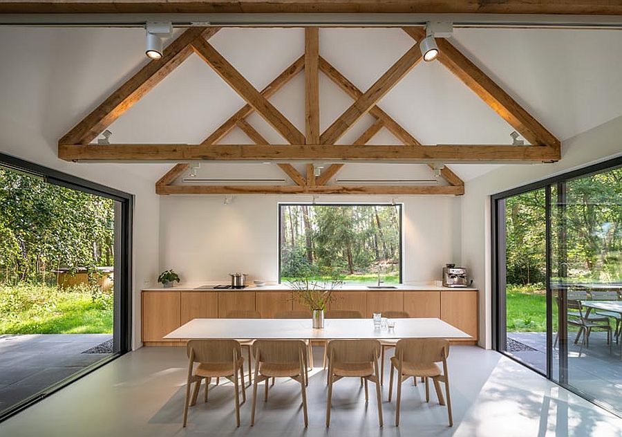 Wooden ceiling beams add support to the structure while offering textural contrast to the interior