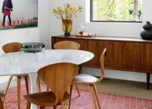 Adapting-a-mid-century-modern-style-allows-you-to-try-out-iconic-decor-pieces-like-the-curvy-Cherner-chair-45781-217x155