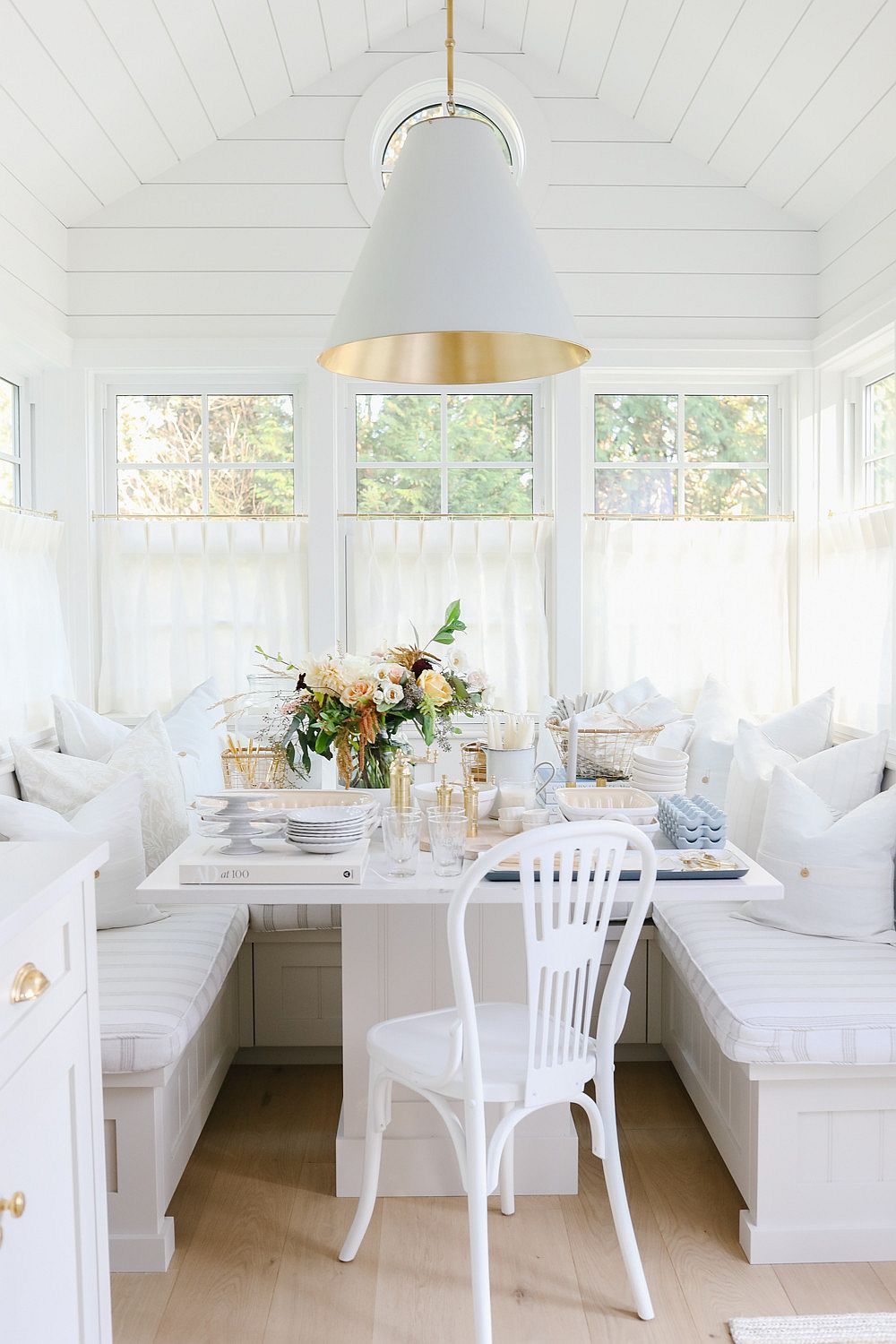 Banquette style seating for the shabby chic dining space that is space-savvy