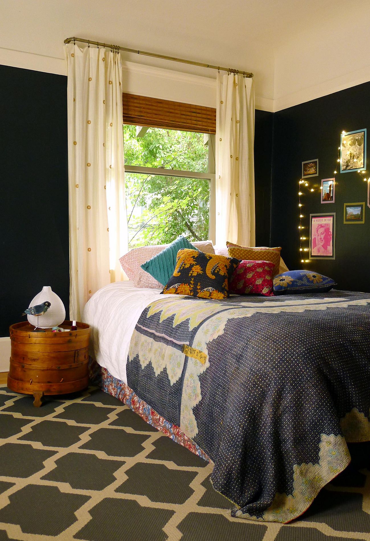 Dark-theme boho-chic bedroom with carpet.