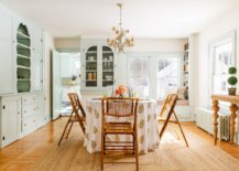 Classy-shabby-chic-dining-space-with-a-round-dining-table-and-ample-shelving-in-the-backdrop-36006-217x155