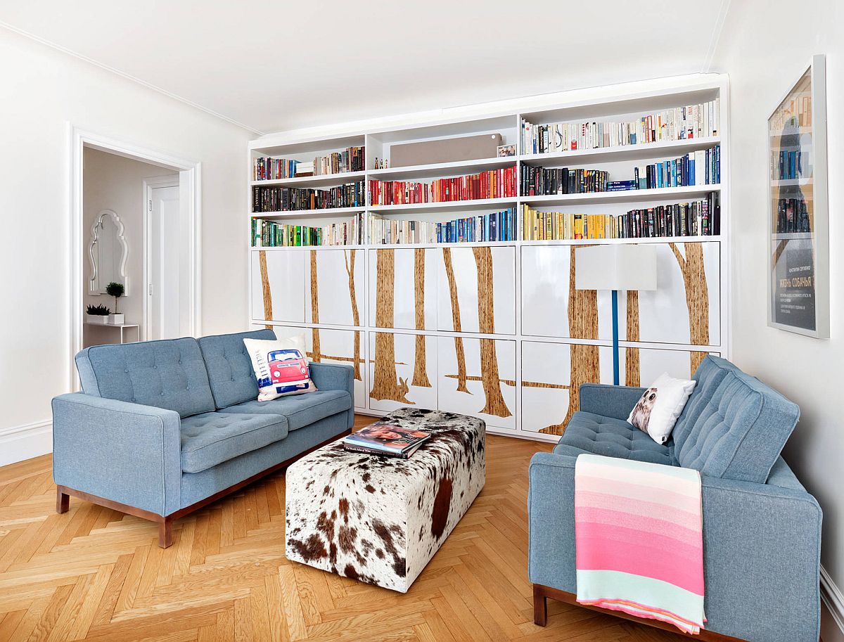 Clever use of tree decals for the lower closed cabinets in the home library gives it a unique look