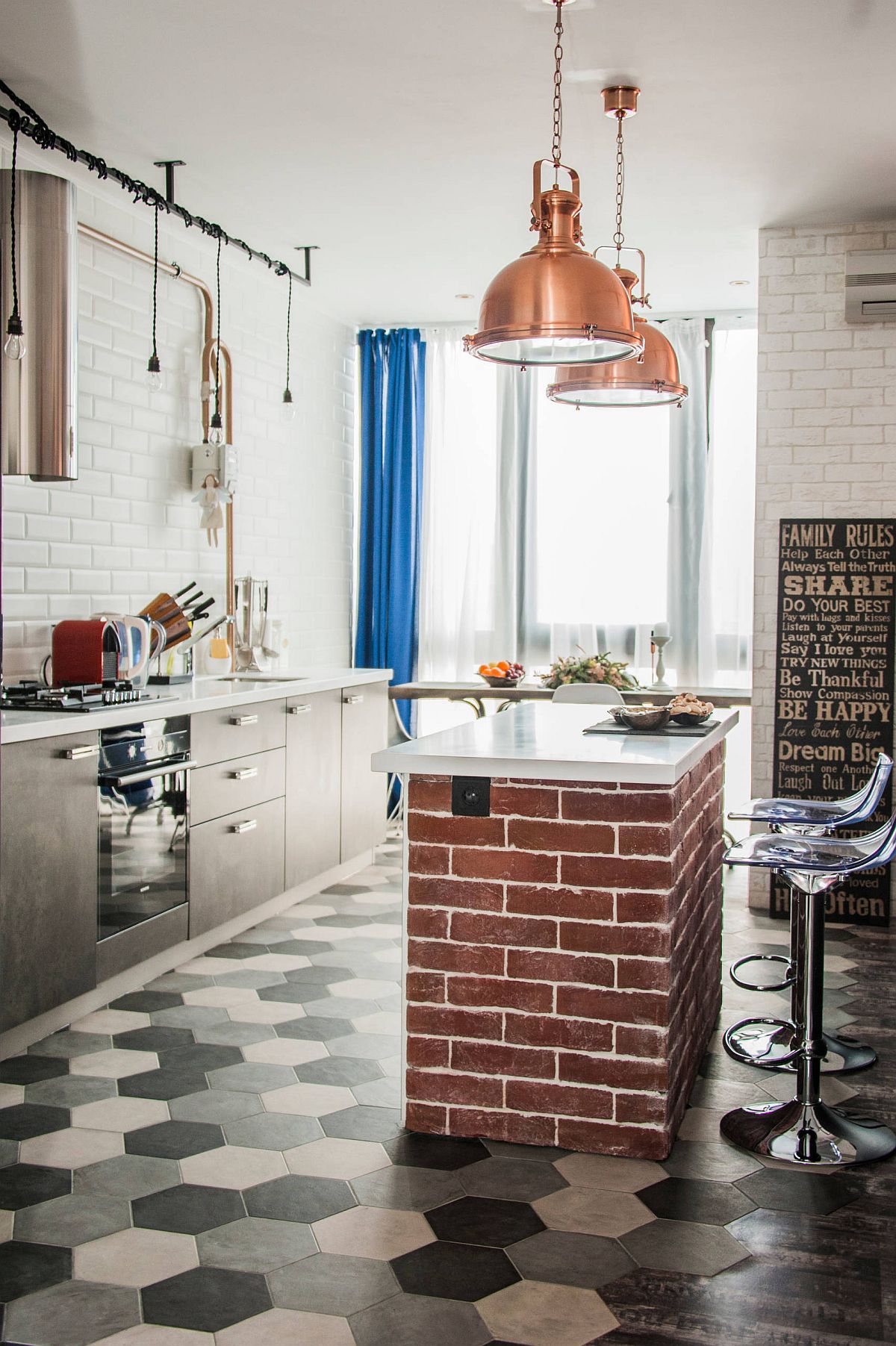 Custom kitchen island that is perfect for small kitchens is draped in brick and features a white countertop