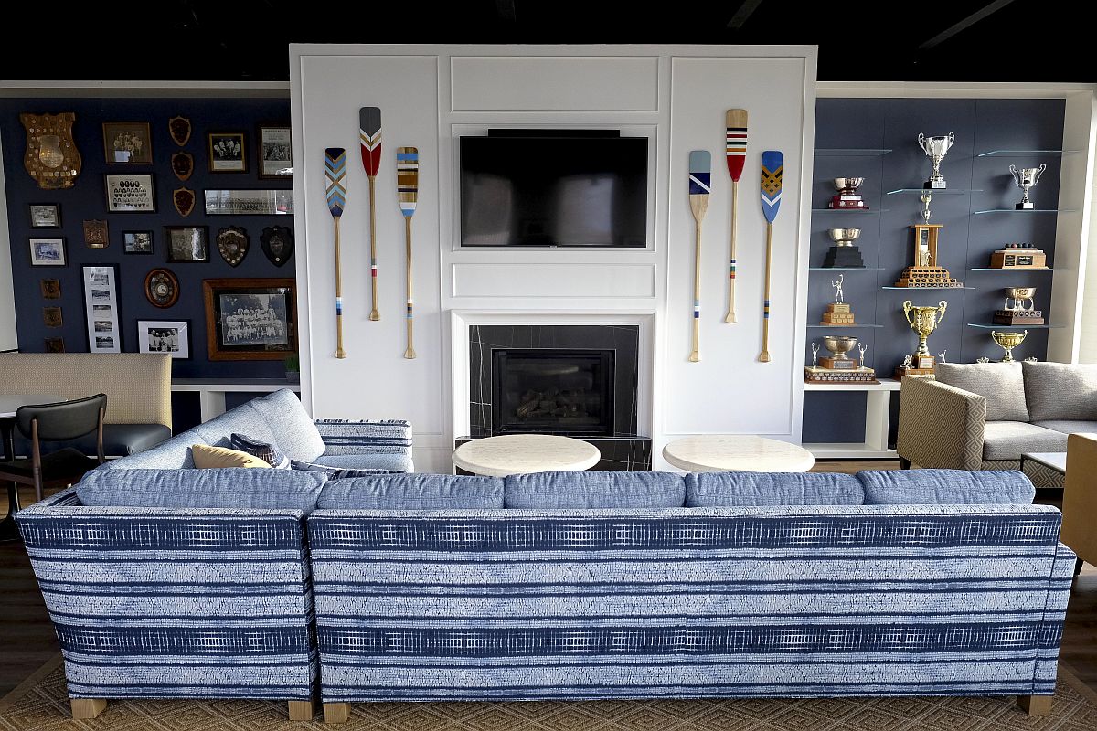 Decorating the space around the fireplace with TV, paddles and memorabilia