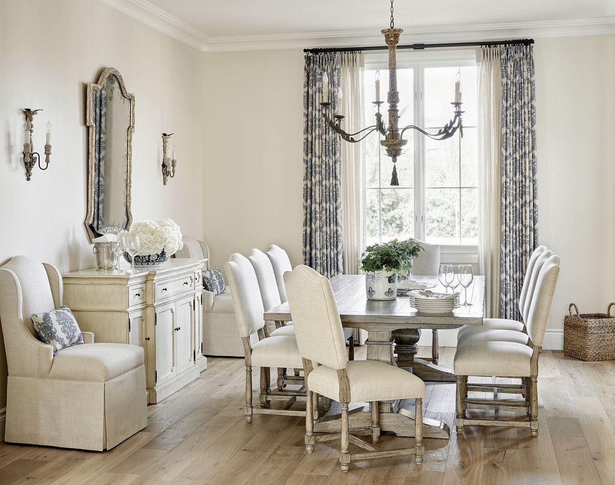 Design that picture-perfect dining room in white with drapes that feature light blue print and plenty of natural light