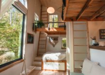 Double-height-ceiling-of-the-cabin-provides-loft-sleeping-spaces-that-offer-privacy-39398-217x155