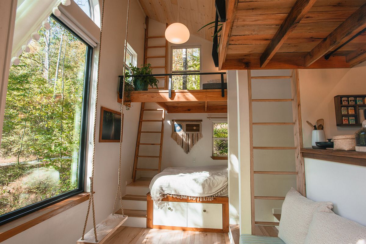 Double-height ceiling of the cabin provides loft sleeping spaces that offer privacy