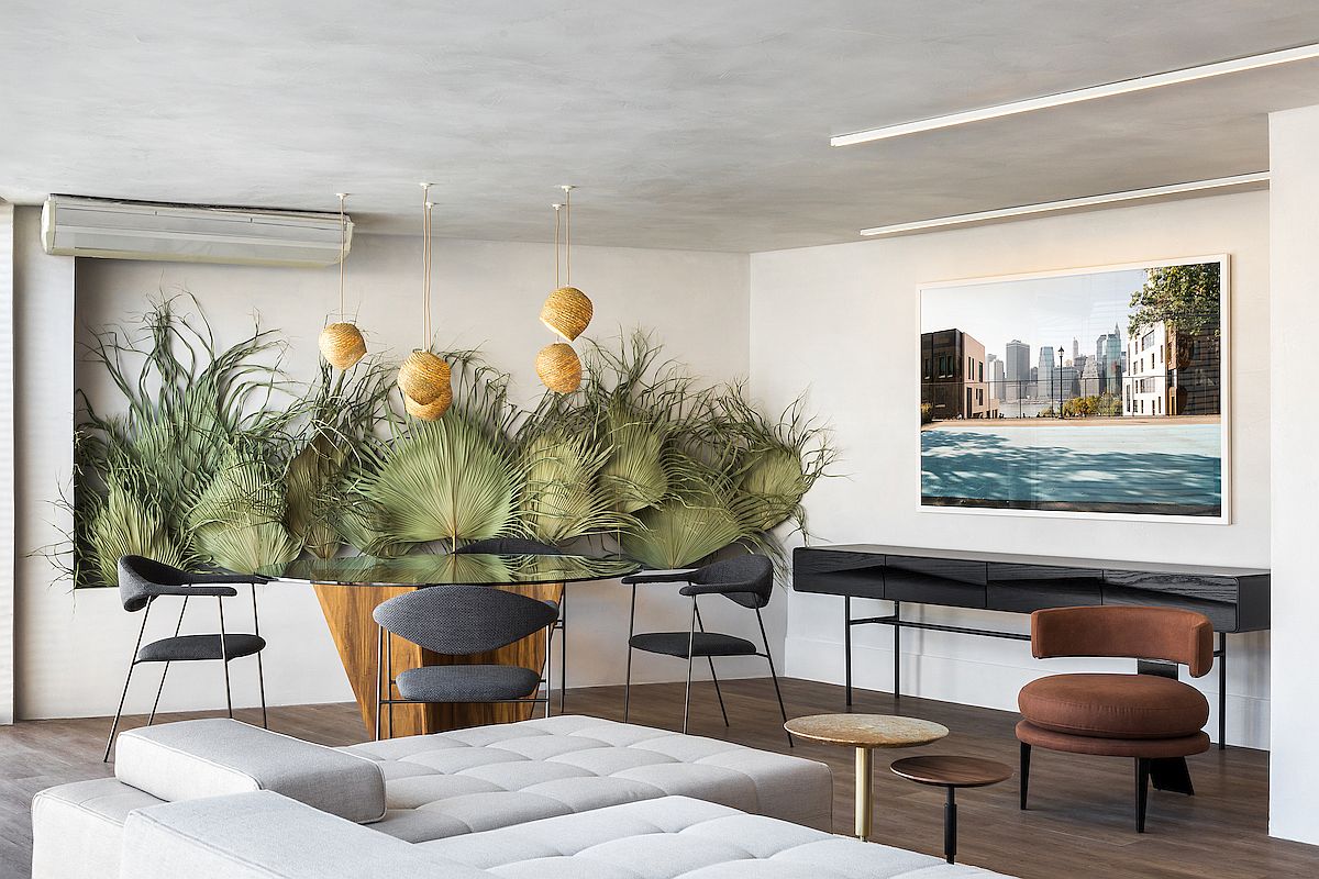 Dried palm leaves in the backdrop bring color and tropical flavor to the modern Moroccan Brazilian apartment